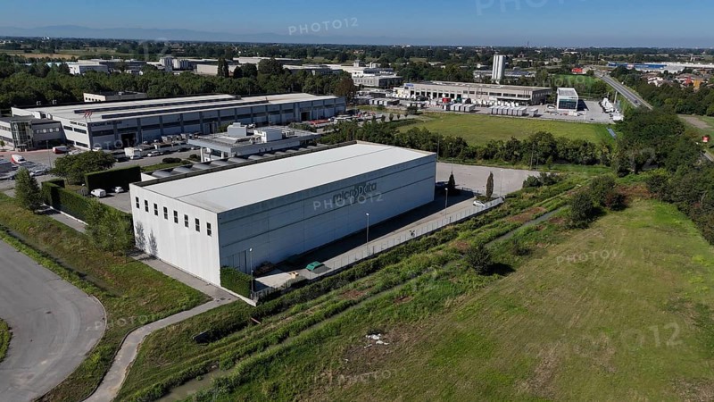 Cremona, Italy August 22nd 2025 Aerial shot revealing modern data center facility, highlighting sleek architectural design and cutting edge technological infrastructure for cloud computing services