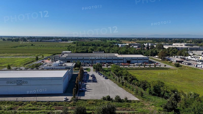 Cremona, Italy - August 22nd 2025 Modern Data Center Facility in Northern Italy Offering Advanced Cloud Storage Solutions Amidst a Rural Industrial Landscape