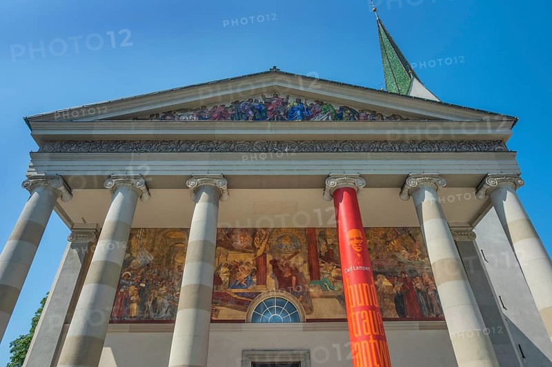 The Roman Catholic parish church of St Martin, entrance with a monumental Ionic temple façade, with six free columns and classical gable triangle and large fresco, Dornbirn, Vorarlberg, Austria