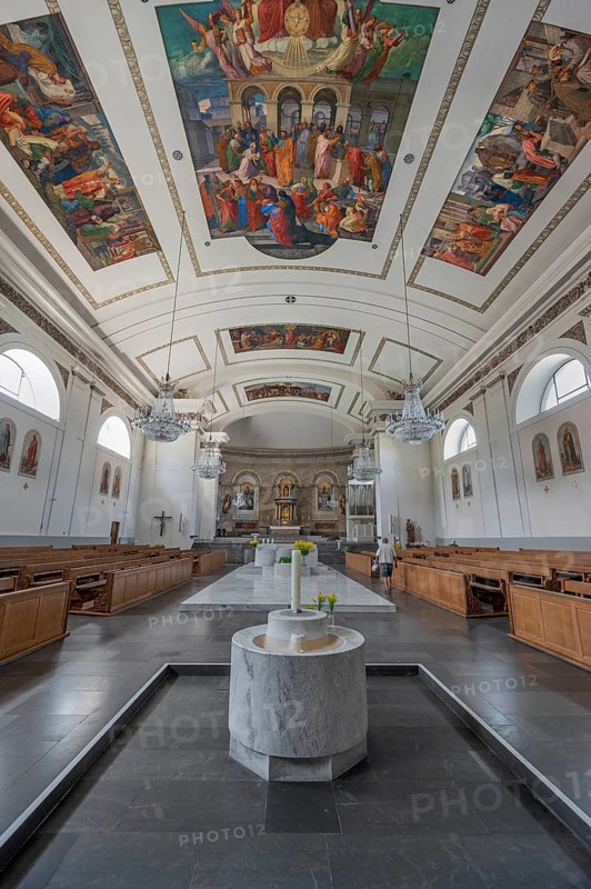 The Roman Catholic parish church of St Martin, interior with altar, ceiling frescoes and baptismal font, Dornbirn, Vorarlberg, Austria
