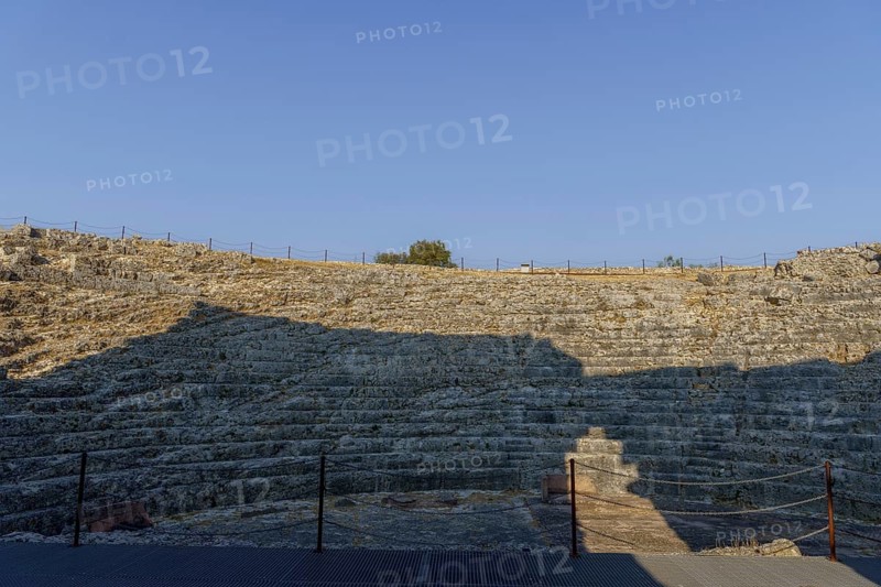 08/21/2025 ronda, malaga, spain Stone steps of a roman theater bask in the sunlight under a vibrant blue sky, showcasing ancient architecture and historical significance