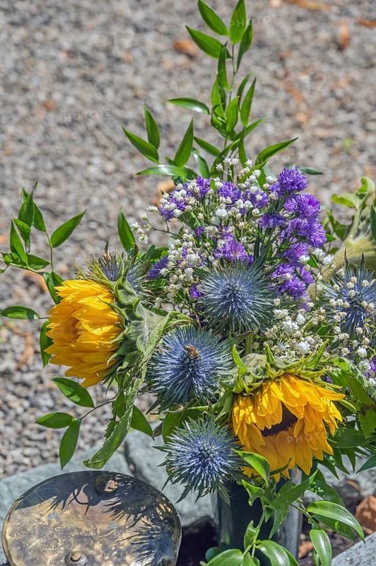 Gravesite with floral decoration, catholic cemetery, Kempten, Allgäu, Bavaria, Germany