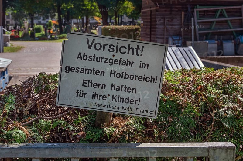 Warning sign, danger of falling, parents are liable for their children, catholic cemetery, Kempten, Allgäu, Bavaria, Germany