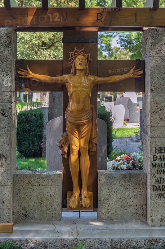 Gravesite with crucifix, catholic cemetery, Kempten, Allgäu, Bavaria, Germany