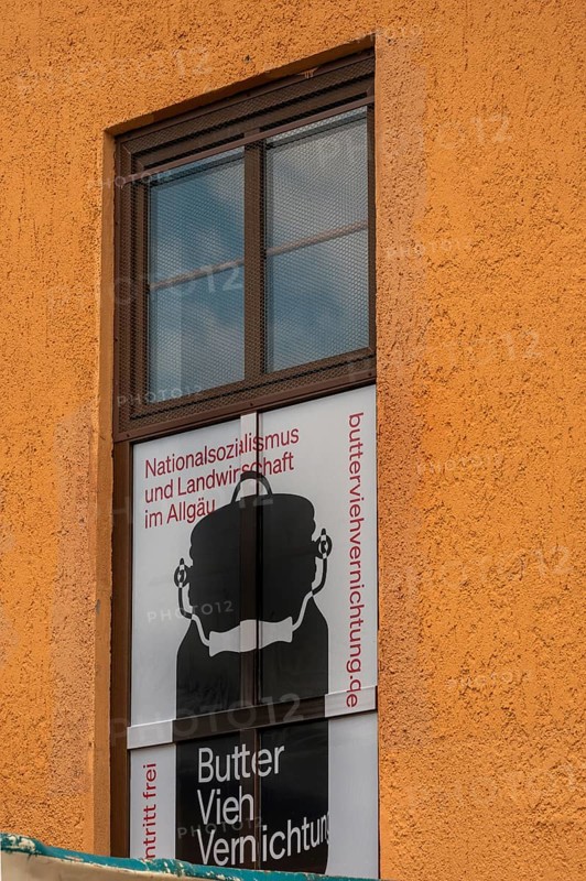 Poster on the facade of the Allgäuhalle, commemoration of National Socialism in agriculture in the Allgäu, Kempten, Allgäu, Bavaria, Germany