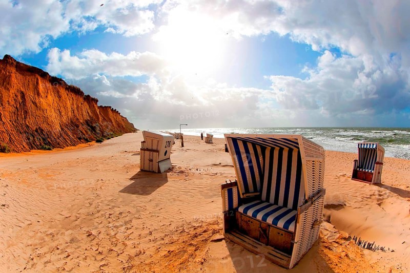 Beach with beach chairs at the Red Cliff near Kampen on Sylt on the North Sea at sunset