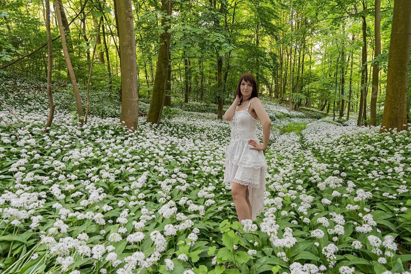 Wild garlic blossom with Sarah below Schaumburg Castle Germany