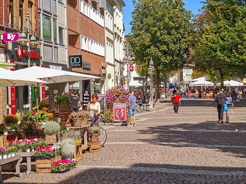 Pedestrian zone, traffic-calmed, old town, architecture, bicycles, café, parasol, flowers, trees, shops, sunshine, Brühl, North Rhine-Westphalia, Germany