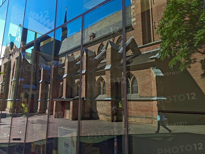 Old town with catholic reflection of St Margaret's Church in glass front, brick building, architecture, religion, Brühl, North Rhine-Westphalia, Germany