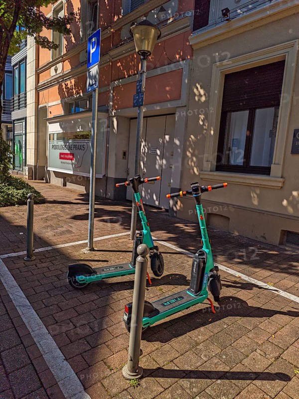 Street in the old town, car park for scooters, e-scooters, sunshine, Brühl, North Rhine-Westphalia, Germany
