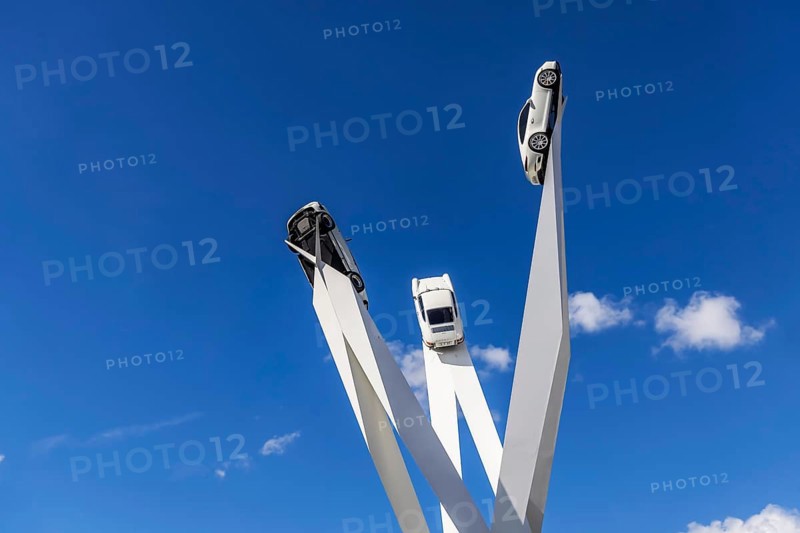 Stuttgart Zuffenhausen with artwork Inspiration 911 by Gerry Judah at Porscheplatz: three steles, each presenting a Porsche 911 at a height of up to 24 metres. Stuttgart, Baden-Württemberg, Germany