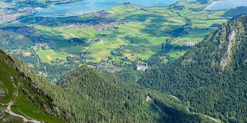 Panorama from the Säuling, 2047m, to Neuschwanstein Castle, Füssen, Schwangau, Sankt Coloman and the Forggensee, Ostallgäu, Bavaria, Germany
