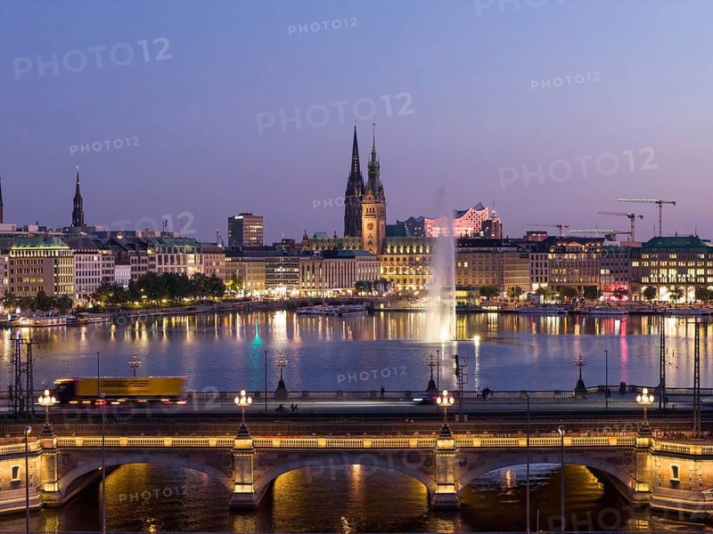 Aerial view of the Outer Alster and Inner Alster with Kennedy Bridge, Alster Fountain, Jungfernstieg, City Hall and Elbphilharmonie at blue hour, Hamburg, Germany