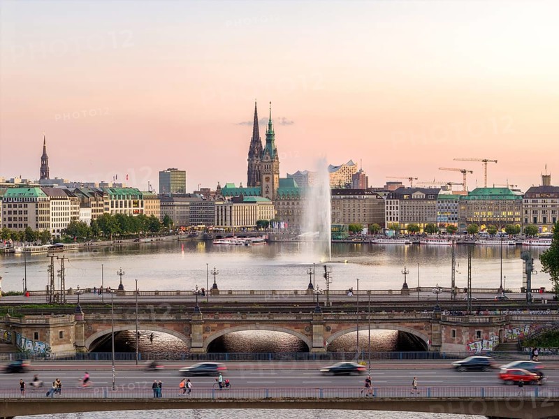Aerial view of the Outer Alster and Inner Alster with Kennedy Bridge, Alster Fountain, Jungfernstieg, City Hall and Elbphilharmonie at sunset, Hamburg, Germany