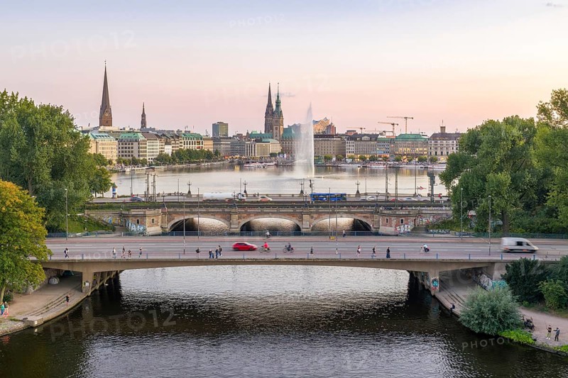 Aerial view of the Outer Alster and Inner Alster with Kennedy Bridge, Alster Fountain, Jungfernstieg, City Hall and Elbphilharmonie at sunset, Hamburg, Germany
