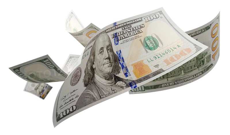Randomly falling U.S. 100 dollar bills isolated on a white background