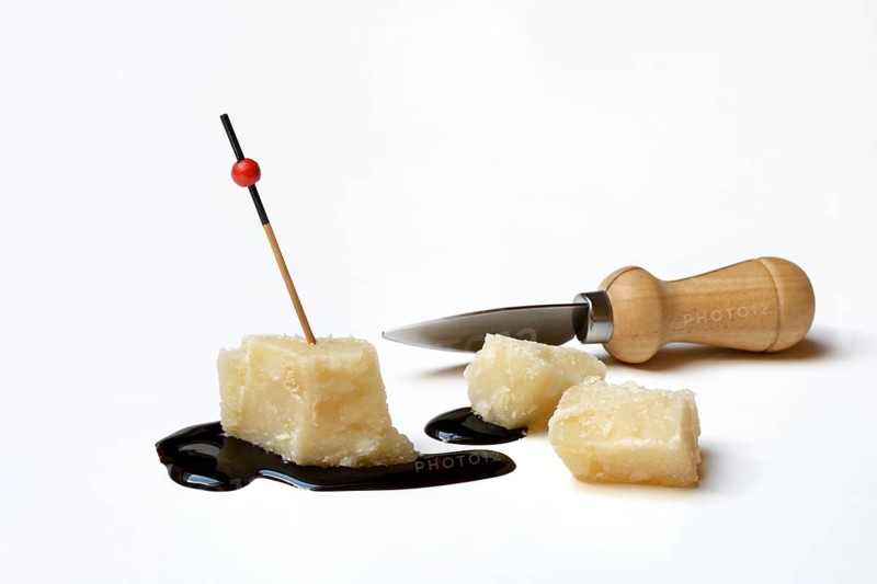 Parmesan cheese, pieces of cheese and crema di balsamico