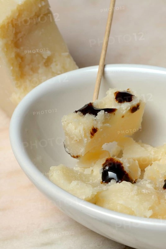 Parmesan cheese, pieces of cheese with crema di balsamico in small bowls