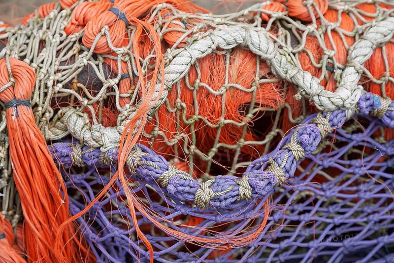 Close-up of superimposed, colourful fishing nets in orange and purple, East Frisia, Lower Saxony, Germany