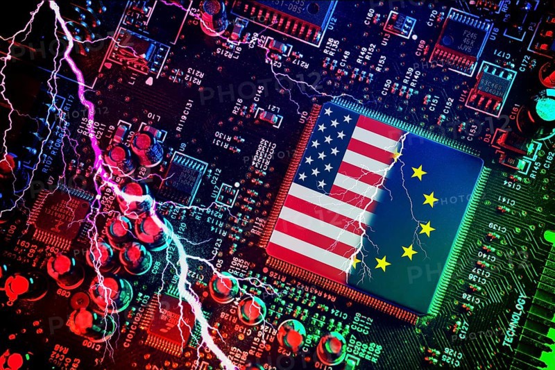 Computer chip with US and EU flags with lightning bolt, symbolic photo Dispute over European digital laws and taxes for US digital companies, photomontage