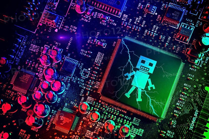 Computer chip with robot figure, symbolic photo of artificial intelligence, photomontage