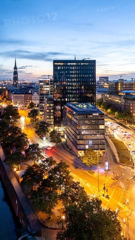 Aerial view of Hamburg's warehouse district during the blue hour with a view of the Zollkanal, Willy-Brandt-Straße, Dovenfleet, St. Katharinen Church and Premier Inn Hamburg Hotel, Hamburg Germany