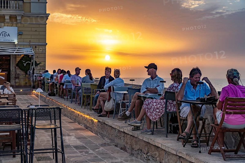 Restaurant by the water at sunset, Gallipoli, Apulia, Italy