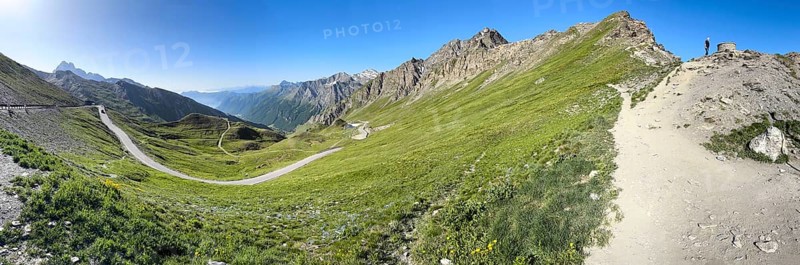 Panoramic view to the left south ramp of the third highest asphalted pass in the Alps highest border pass 2744 m high Col Agnel Colle dell' Agnello Pass in the High Alps Alpine pass above tree line mountain road Alpine road, right at the edge of the picture path to and viewpoint, Col Agnel, Colle dell'Agnello, Pontechianale, Piedmont, Italy