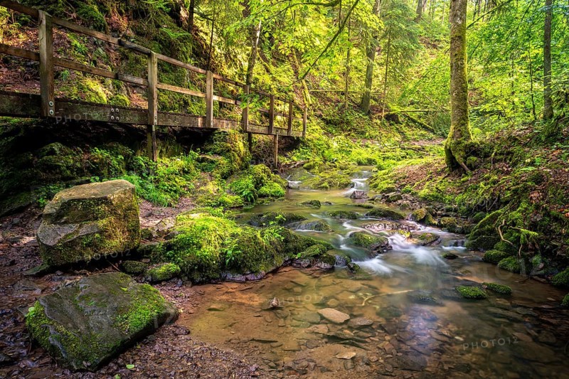 Lotenbachklamm, landscape in the Black Forest, hiking trail with wooden bridge, Lotenbach with rocks. Long exposure. Lotenbachklamm gorge in the Wutachschlucht gorge, Upper Black Forest, Baden-Württemberg, Germany