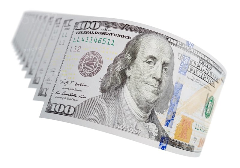 Abstract set of U.S. 100 dollar bills isolated on a white background