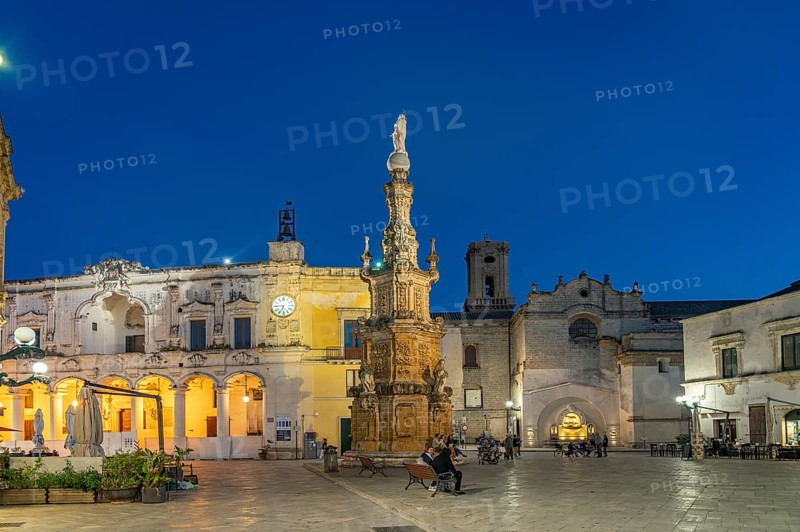 Piazza Salandra with the Guglia dell'Immacolata column and Palazzo di città at dusk, Nardo, Apulia, Italy