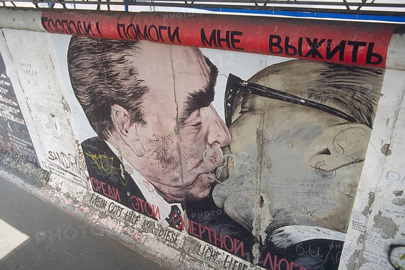 Artwork shows Leonid Brezhnev and Erich Honecker kissing, painting was created in 1990 at the Berlin Wall, Berlin, Germany