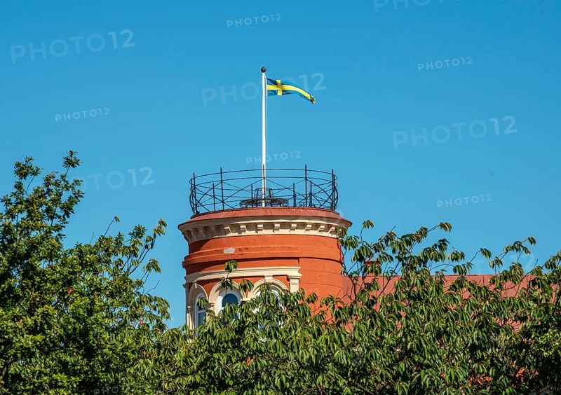 Swedish flag on a tower and at blue sky in Ystad, Skåne county, Sweden, Scandinavie