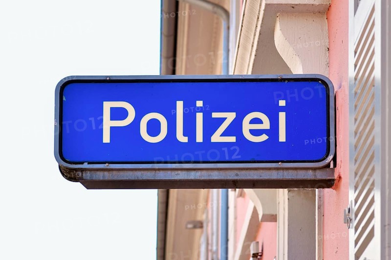 Ettlingen, Germany - August 13th 2025: German police sign with the word Polizei on building