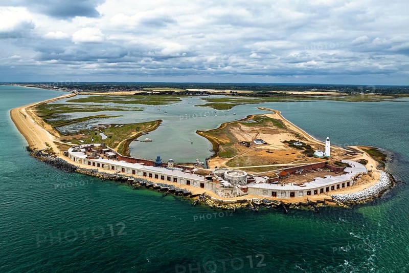Hurst Point Lighthouse and Hurst Castle from drone over Hurst Spit, Milford on Sea, Lymington, Hampshire, England, United Kingdom