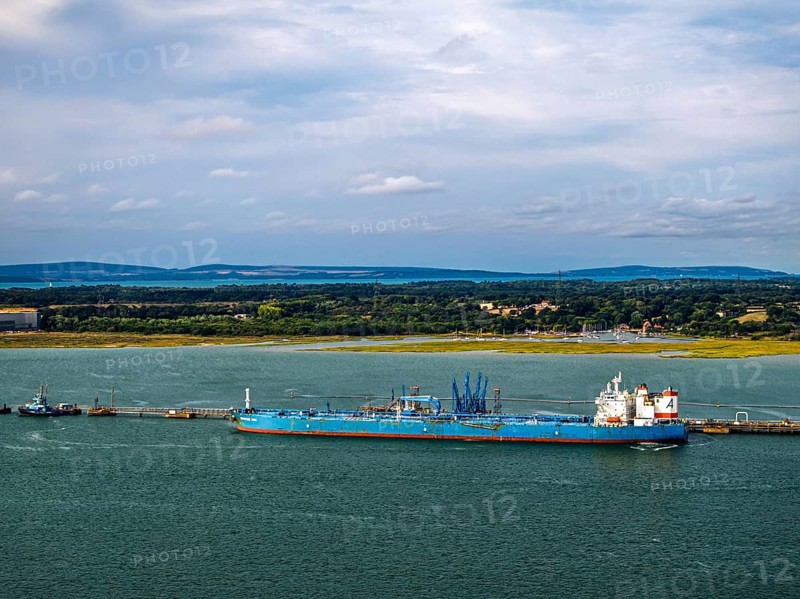 Gas tankers over refinery Esso Oil Terminal from drone, Southampton, Hampshire, England, United Kingdom