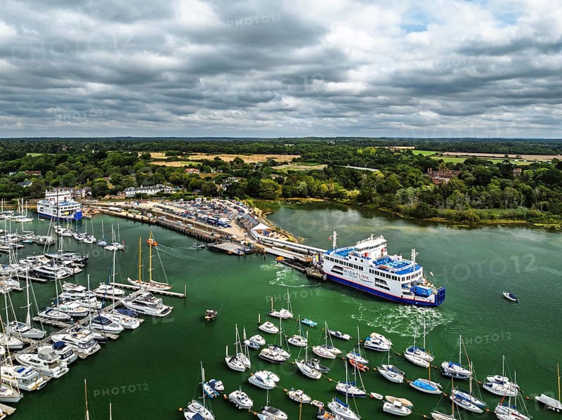 Wight Light car ferry to Isle of Wight on Lymington River and marina from drone, Lymington, New Forest, Hampshire, England, United Kingdom