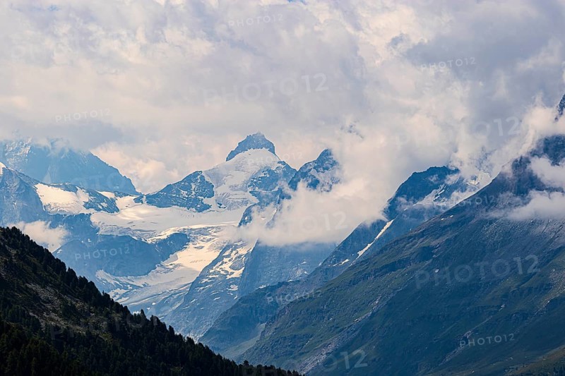 Four-thousand metre mountains and glaciers in clouds, above Zinal, Val d'Anniviers, Valais Alps, Canton Valais, Switzerland