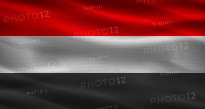 Yemen flag with fabric texture. Realistic flag of Yemen waving