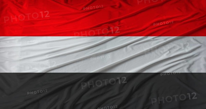 Close up of Yemen flag waving. Flag of Yemen with cloth texture
