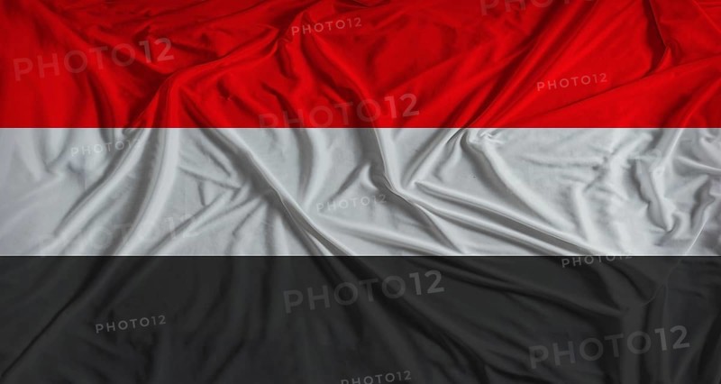 Yemeni flag with fabric texture background. National flag of Yemen with cloth texture