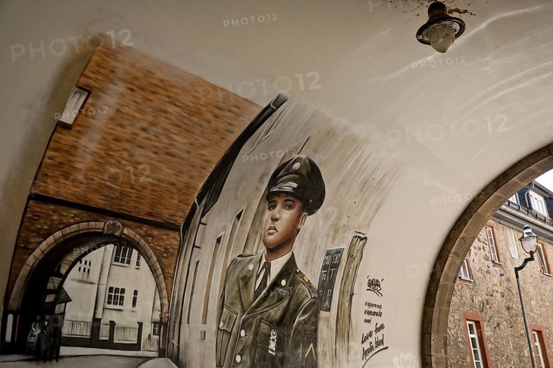 Graffiti by Gnasher in the archway, the castle gate was the backdrop for the cover of the Elvis Presley single A Big Hunk o' Love, Bad Nauheim, Hesse, Germany