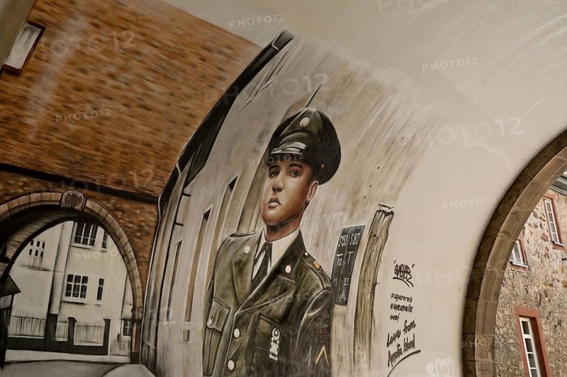 Graffiti by Gnasher in the archway, the castle gate was the backdrop for the cover of the Elvis Presley single A Big Hunk o' Love, Bad Nauheim, Hesse, Germany