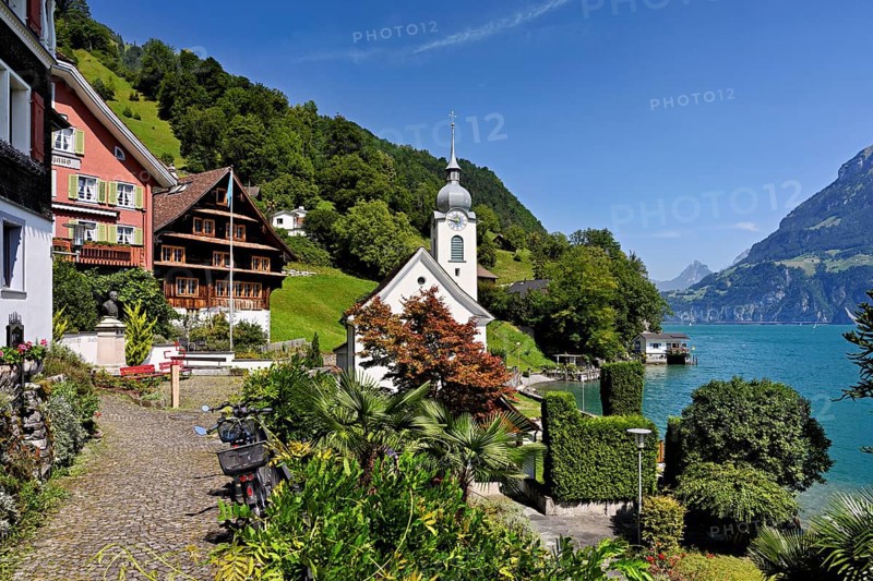View of the village with the Roman Catholic Church of St Idda, Lake Lucerne in the background, Bauen, Canton, Uri, Switzerland