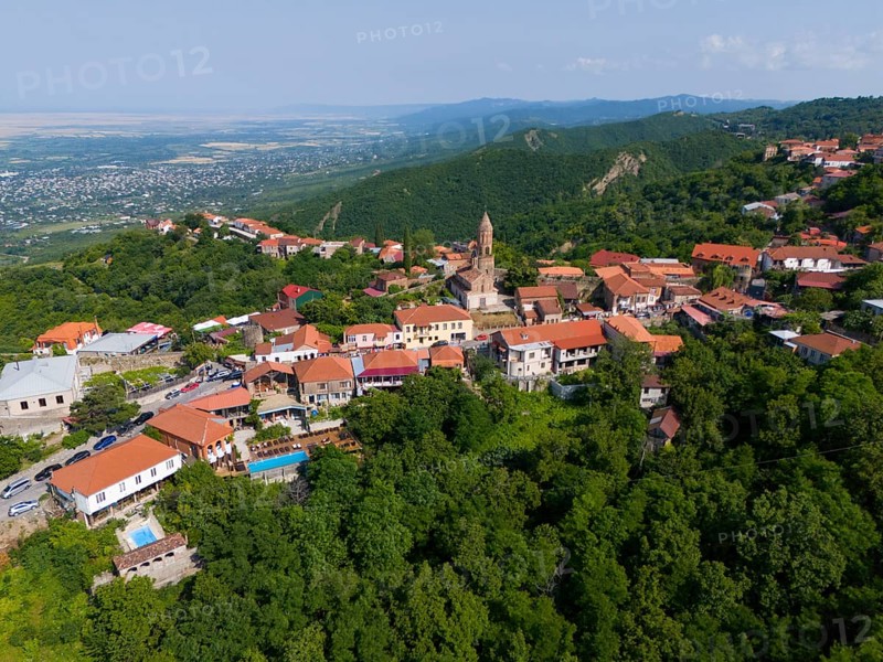 Sweeping view over a hilly region with town and traditional buildings, aerial view, Sighnaghi, Signagi, Kakheti Province, Greater Caucasus, Georgia, Near East