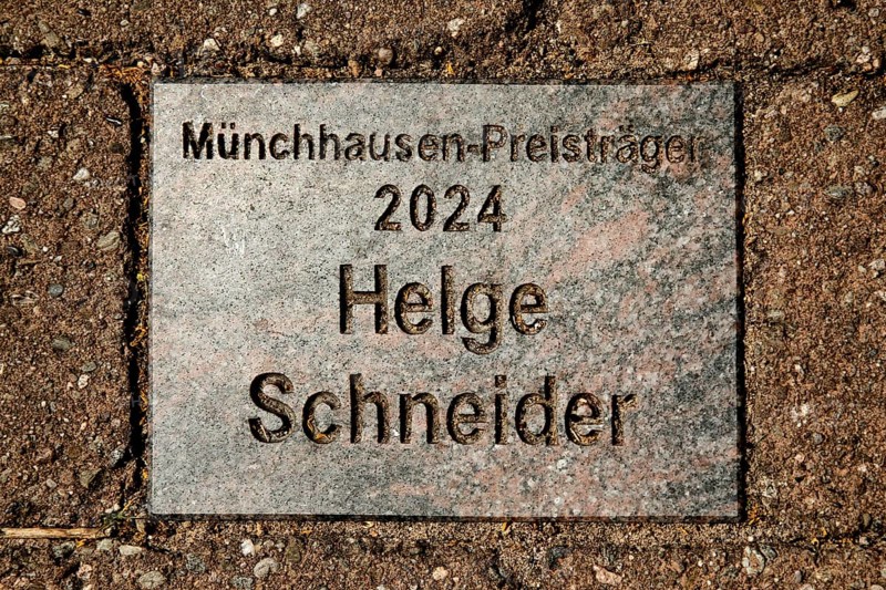 Sign for the 2024 Münchhausen Award winner Helge Schneider in the Münchhausen town of Bodenwerder, Weserbergland, Lower Saxony, Germany