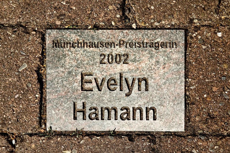 Sign for the 2002 Münchhausen Prize winner Evelyn Hamann in the Münchhausen town of Bodenwerder, Weserbergland, Lower Saxony, Germany