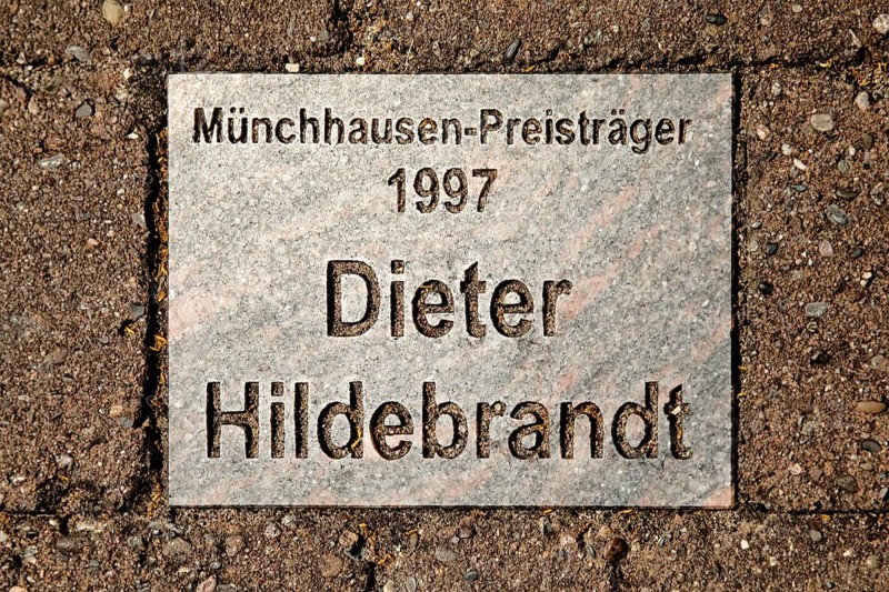 Sign for the 1997 Münchhausen Prize winner Dieter Hildebrandt in the Münchhausen town of Bodenwerder, Weserbergland, Lower Saxony, Germany