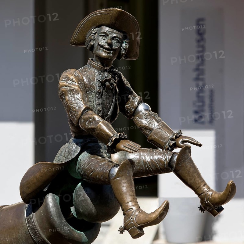 Munchausen figure, The Ride on the Cannonball, Munchausen Fountain by Bonifatius Stirnberg in Bodenwerder, Weserbergland, Lower Saxony, Germany