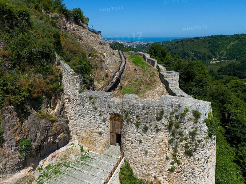 Old castle ruins amidst lush vegetation and under a clear sky, aerial view, Ünye Castle, Ünye Kalesi, Inkur, Ünye, Ordu Province, Turkey